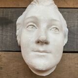 Plaster face wall statue