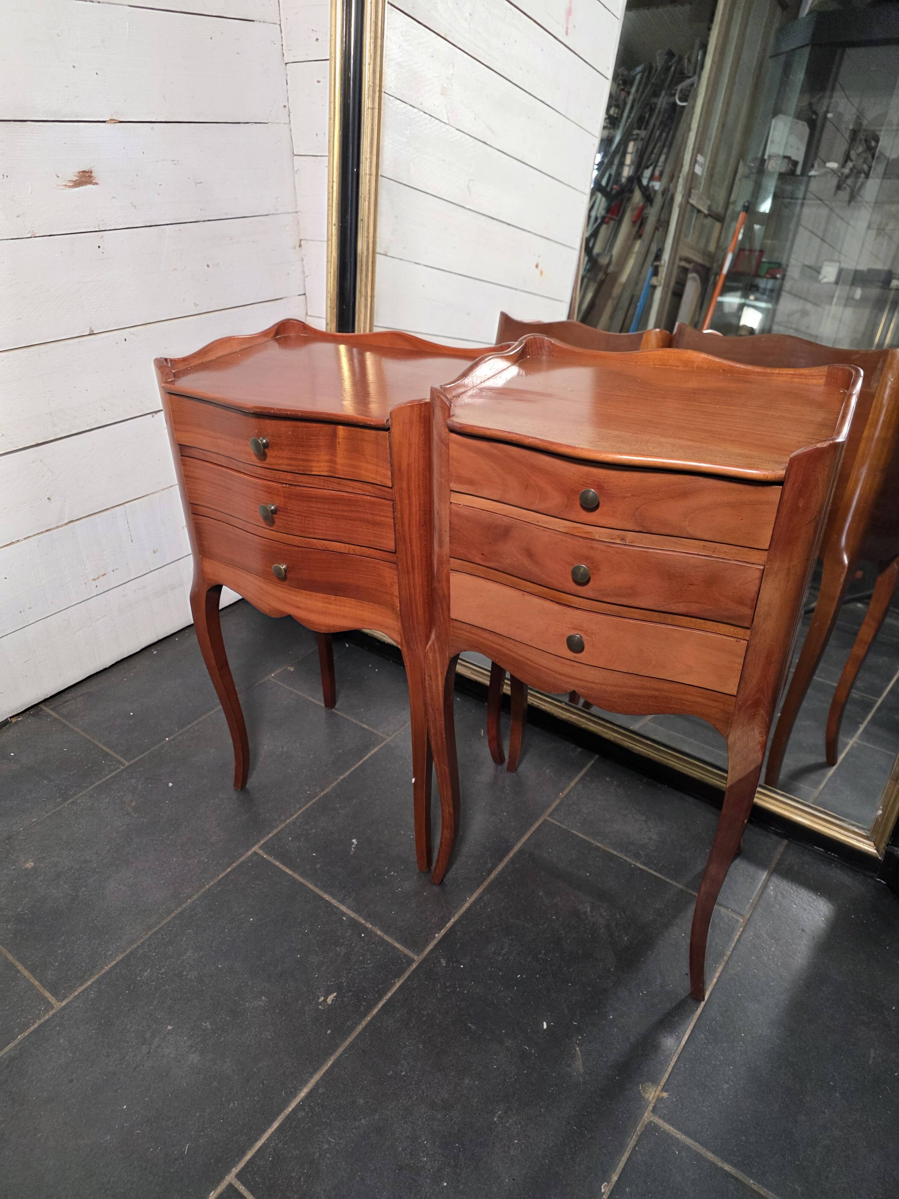 Pair of Louis XV style bedside tables in cherry wood.