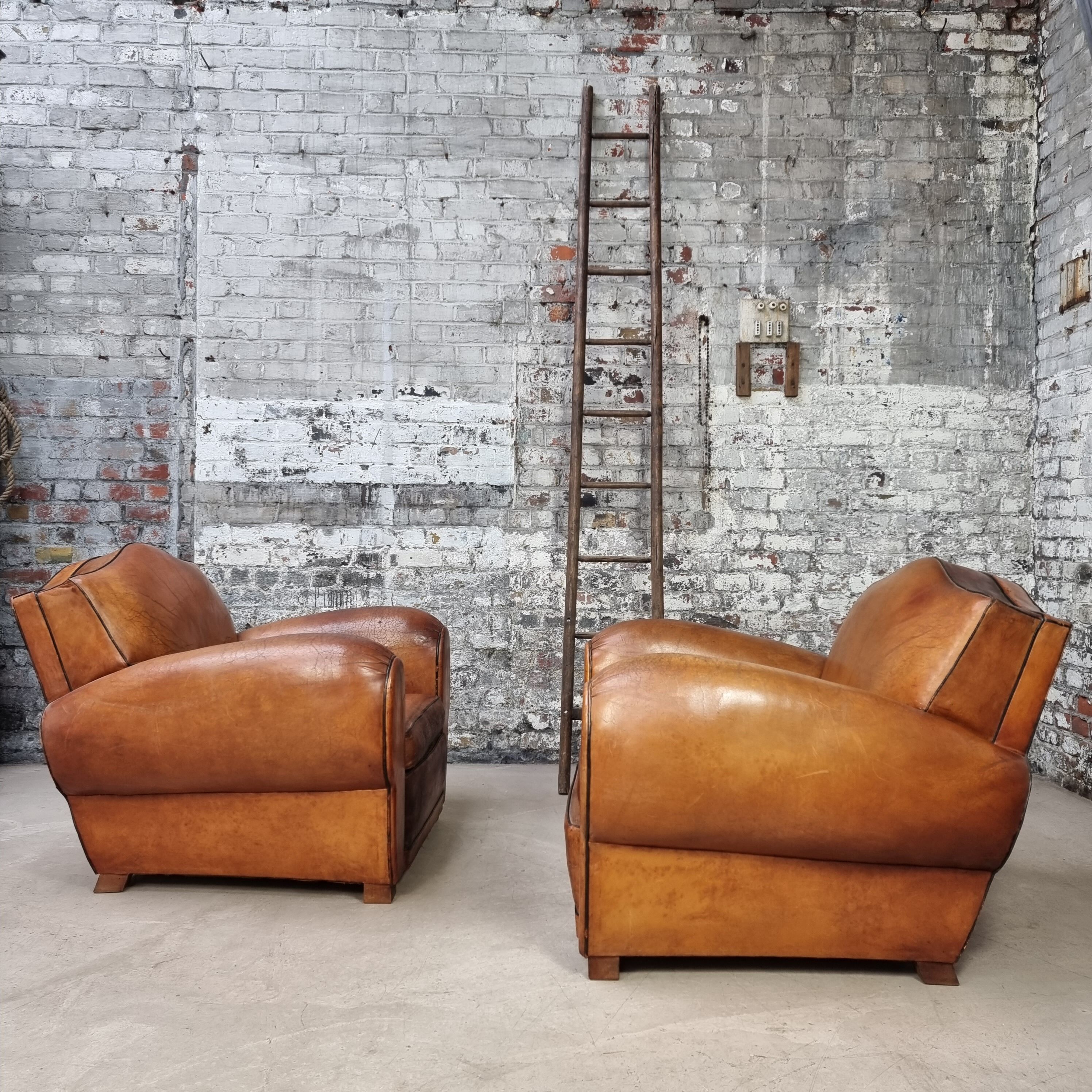 Pair of leather club chairs