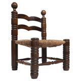 Low woven straw chair in the manner of Charles Dudouyt, 1940s