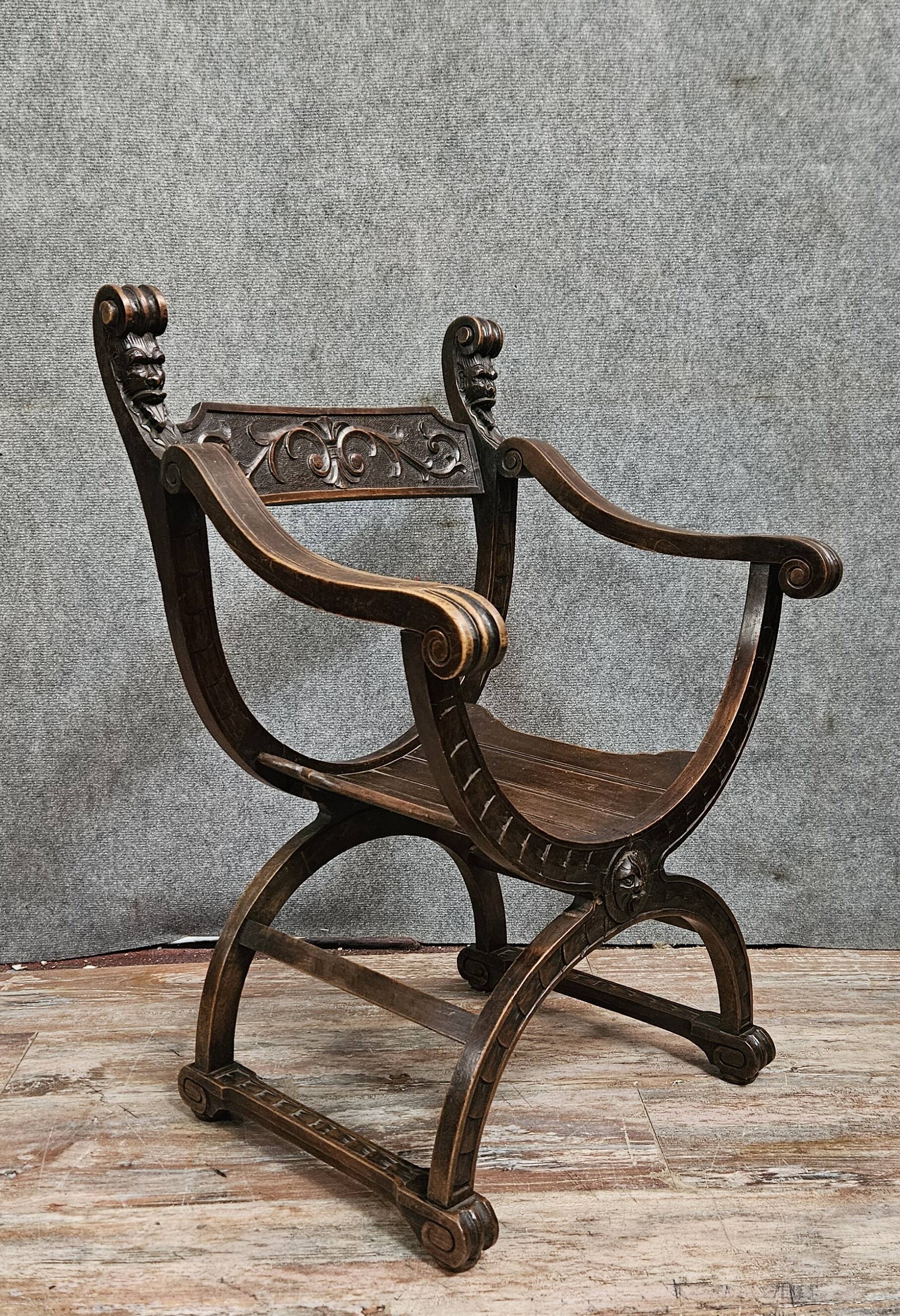Antique curule chair in carved wood – Renaissance / Savonarole style