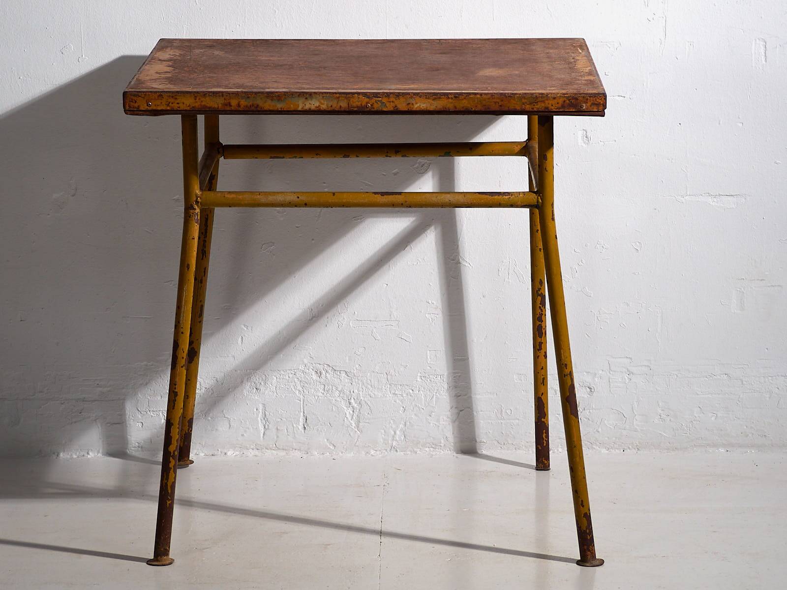 Antique ochre-colored outdoor table (c.1920)