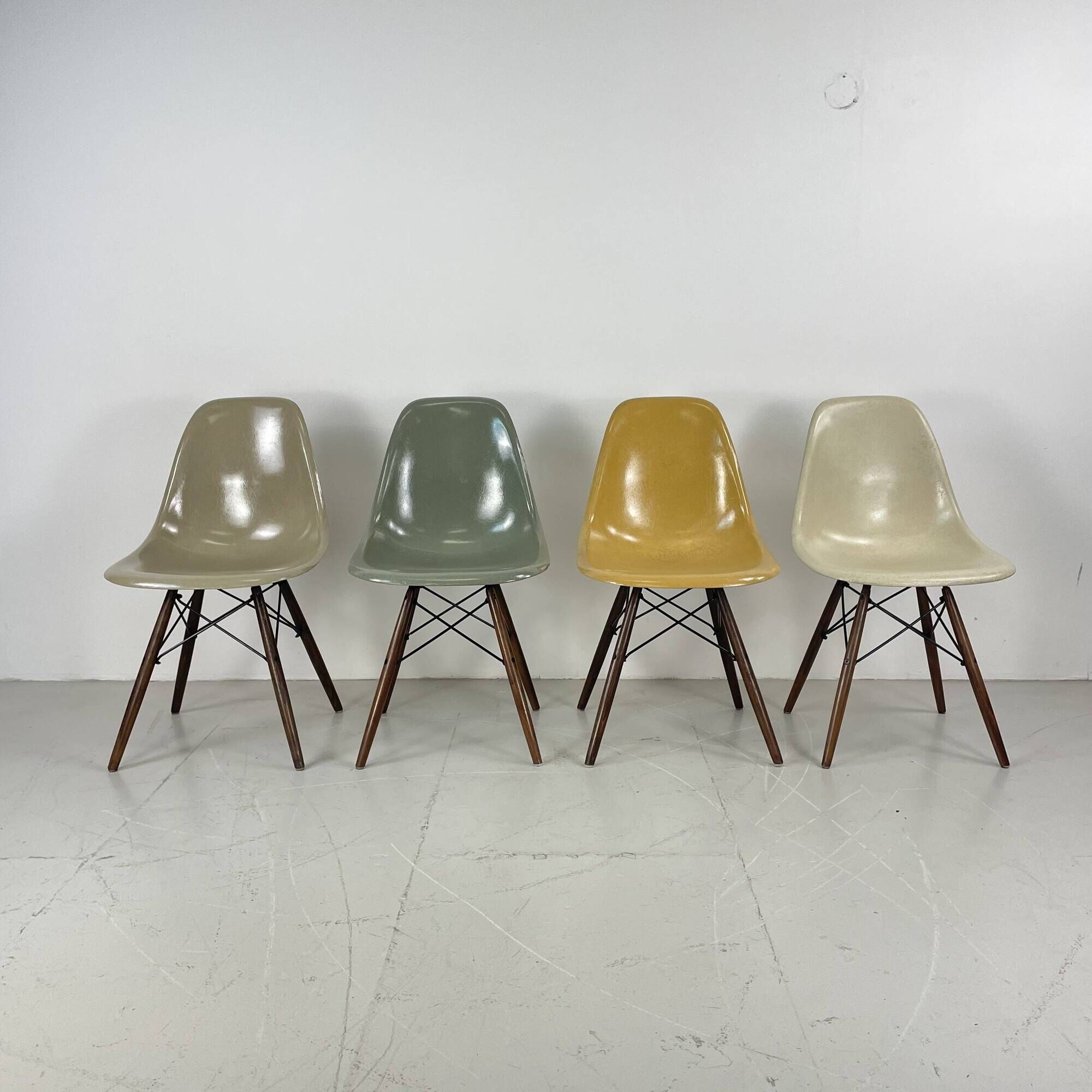 Eames Herman Miller DSW side chairs in greige, seafoam green, light ochre and parchment with slight