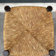 Old high bar stool in wood and straw