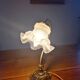 Art Nouveau bedside lamp in bronze with a tulip shape.