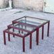 Nesting tables in burgundy lacquered metal and brass, France 1950s