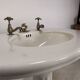 Porcelain sink basin on pedestal
