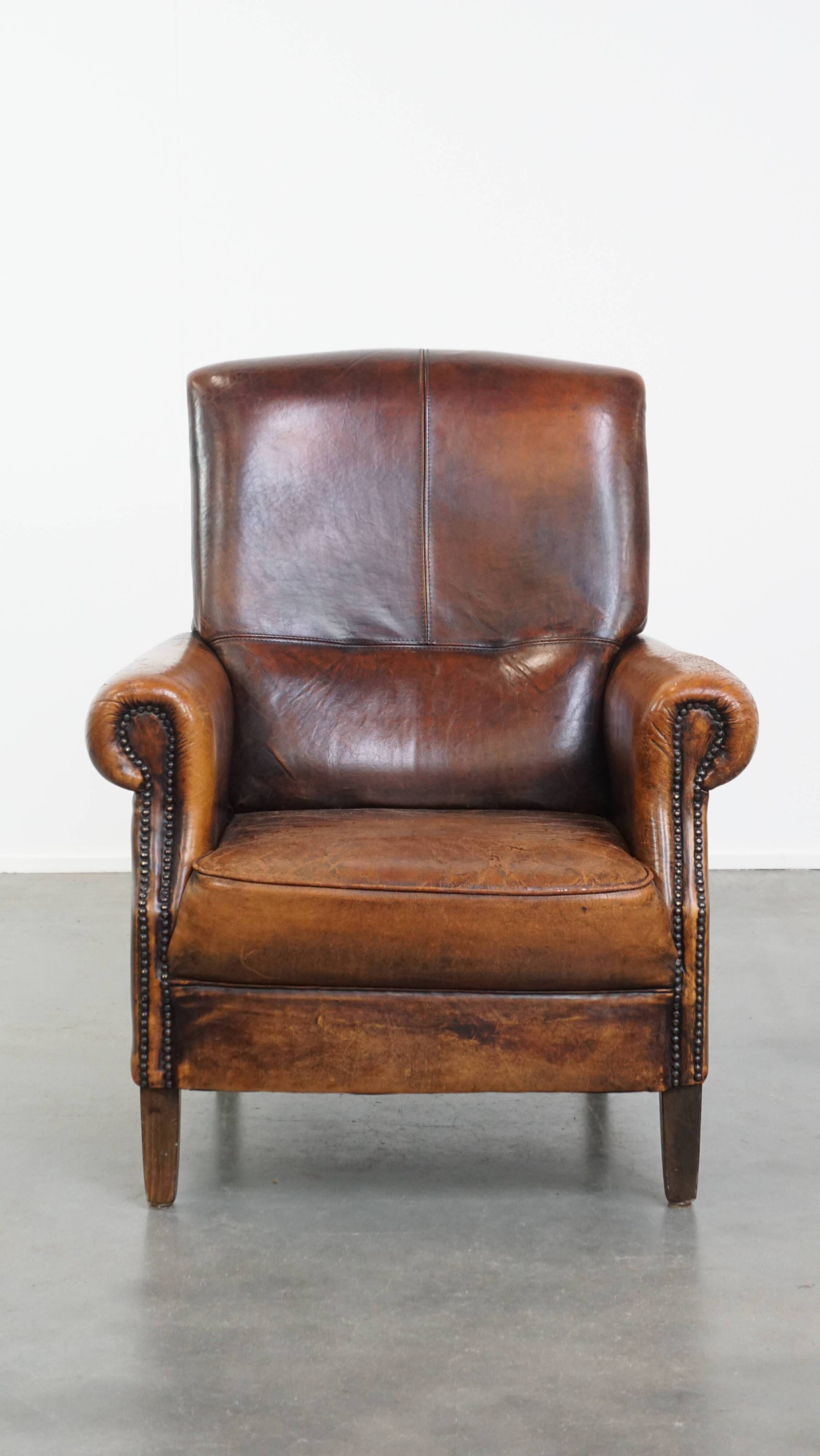 Fauteuil vintage en cuir de mouton avec dossier haut