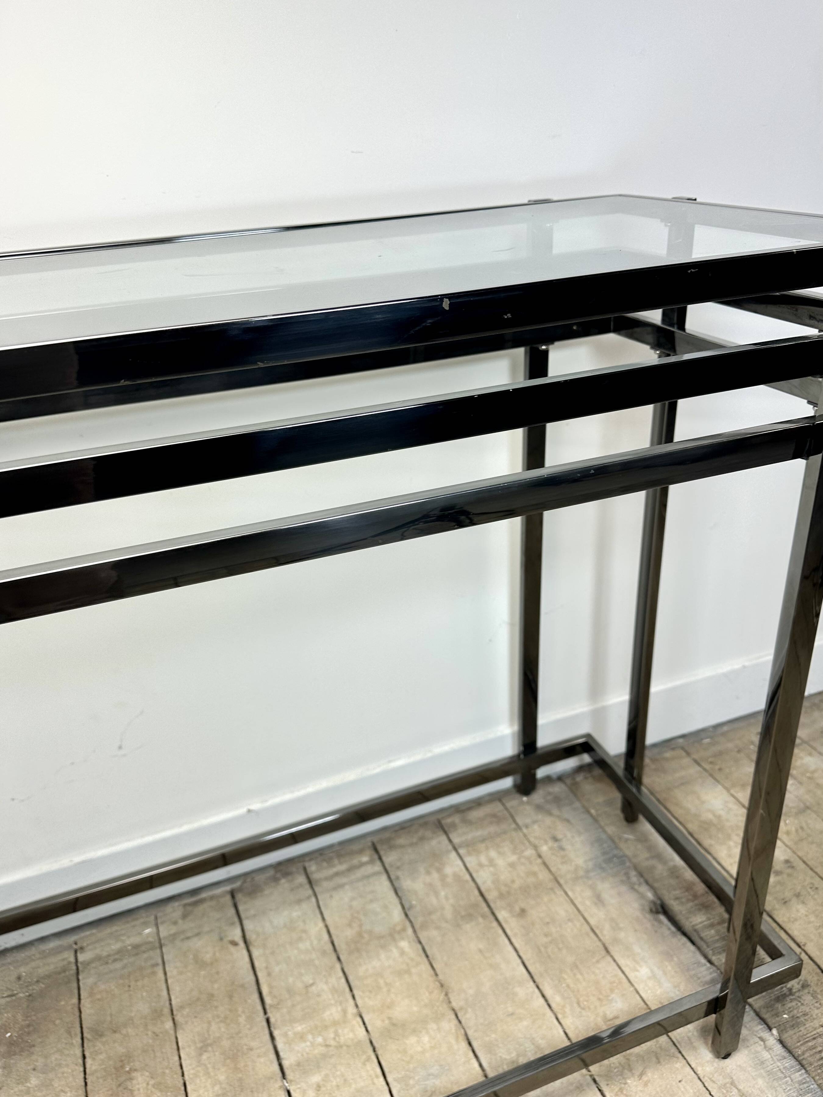 Smoked silver metal console from the 2000s.