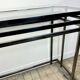 Smoked silver metal console from the 2000s.