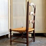 Low Provencal chair in dark wood and woven straw