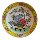 Yellow porcelain plate with saturated and vivid colors. Handmade in Japan