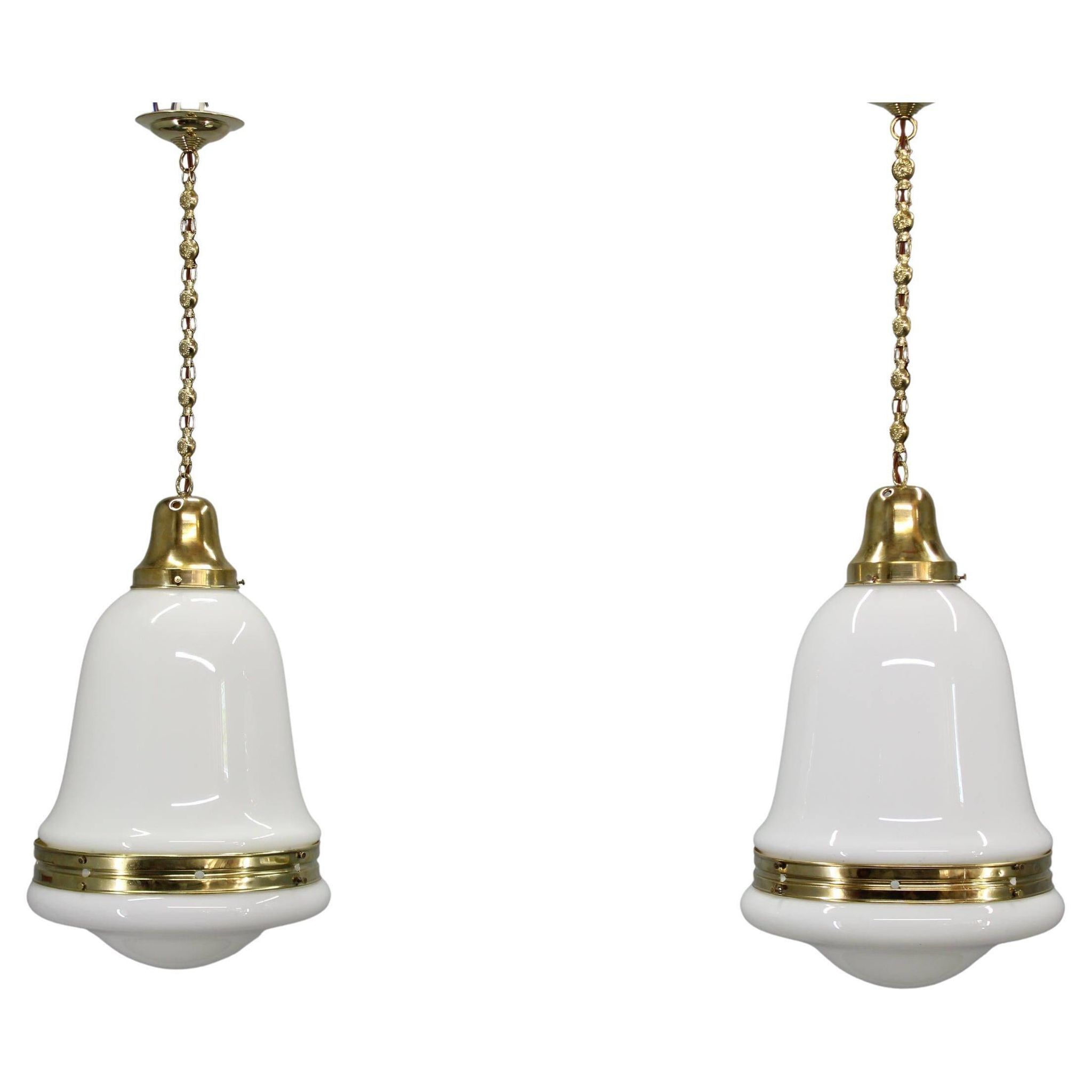 Pair of 1930s Peter Behrens Luzette pendants in opaline glass and brass
