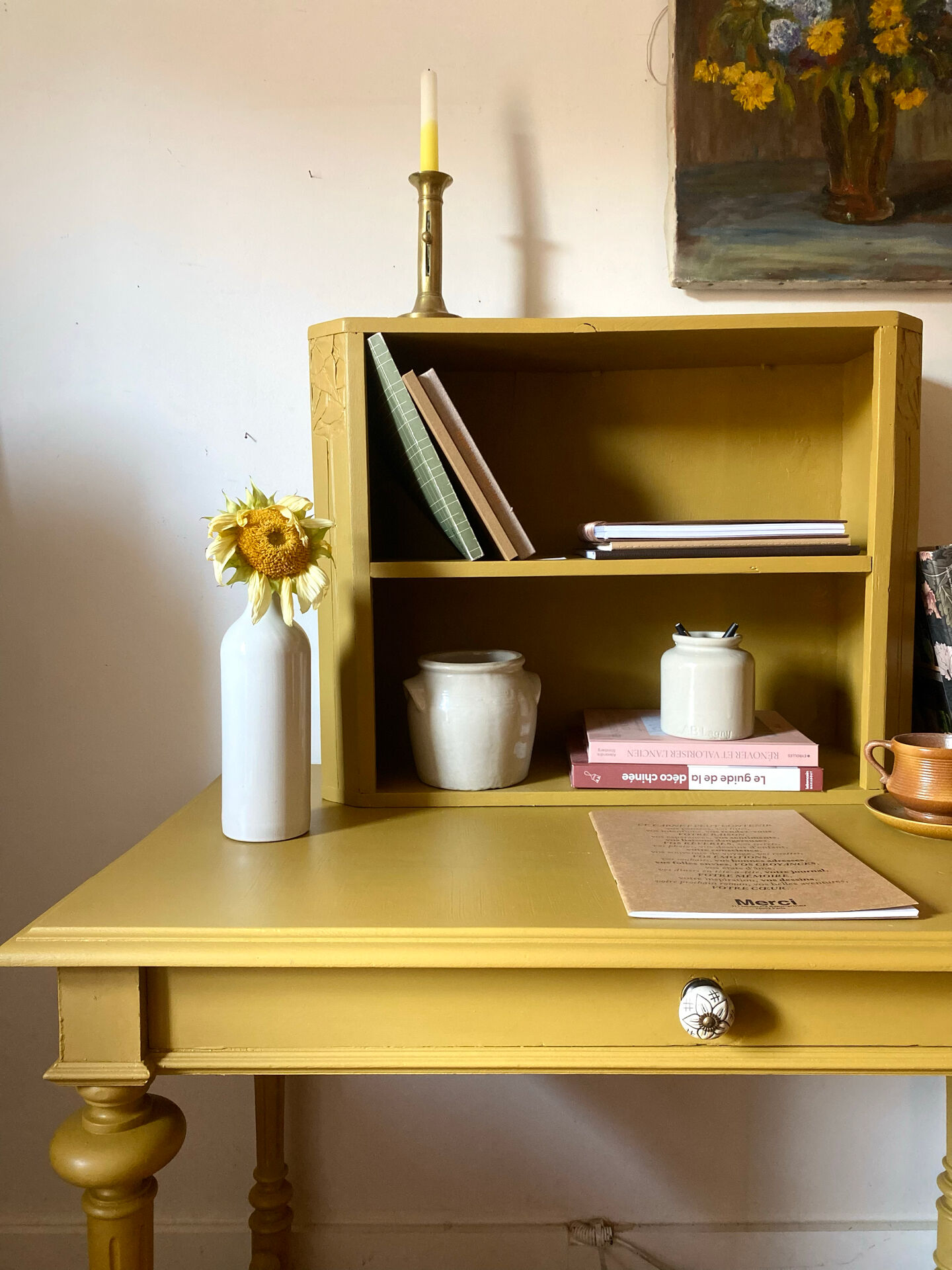 Desk table from the late 19th century, painted mustard, with turned stretcher.