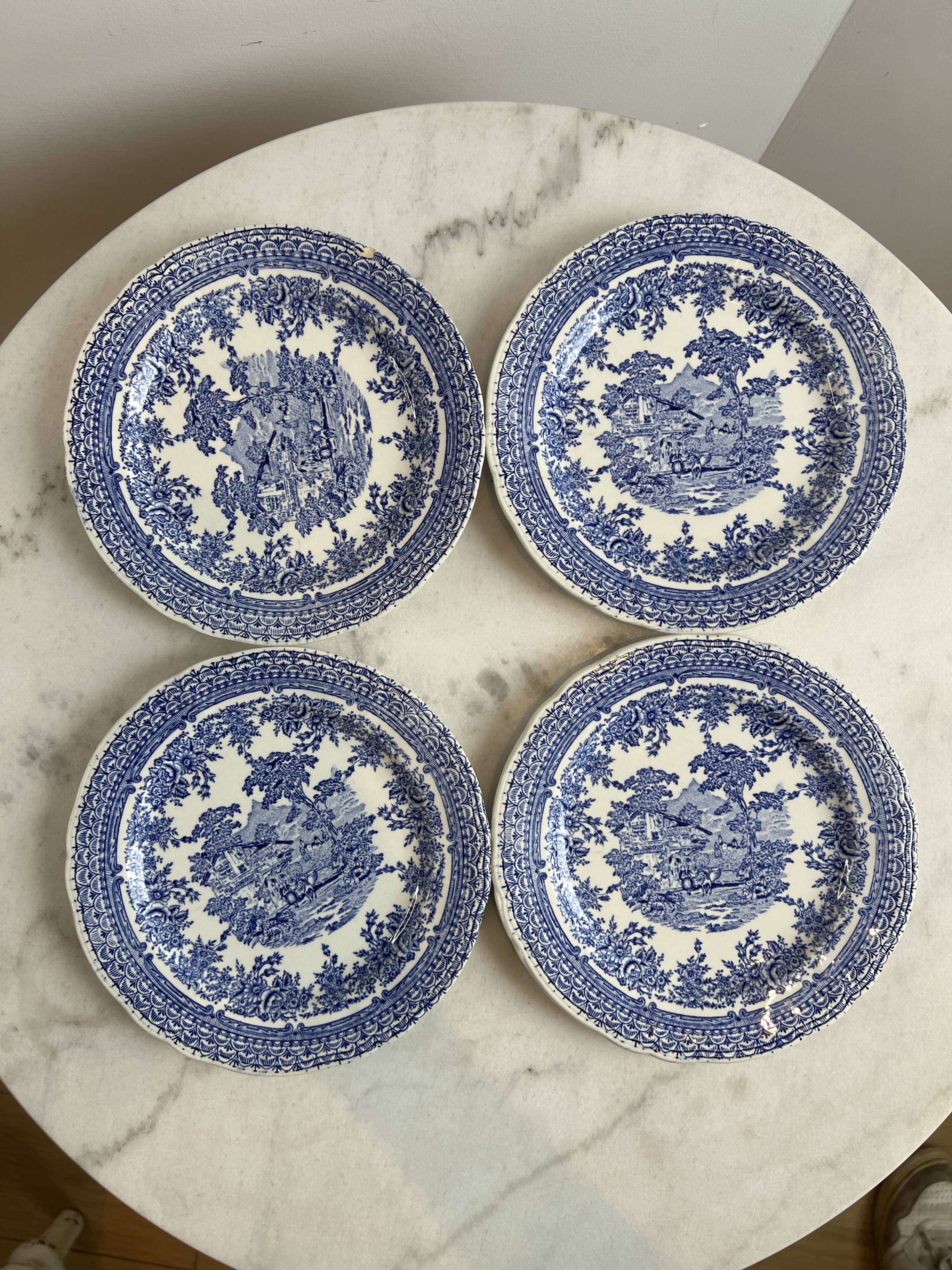 Set of four flat plates from English earthenware.