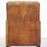 Art Deco design sheepskin leather armchair with a stunning patina