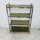 Chrome and smoked glass shelf in Italian 1970s style.