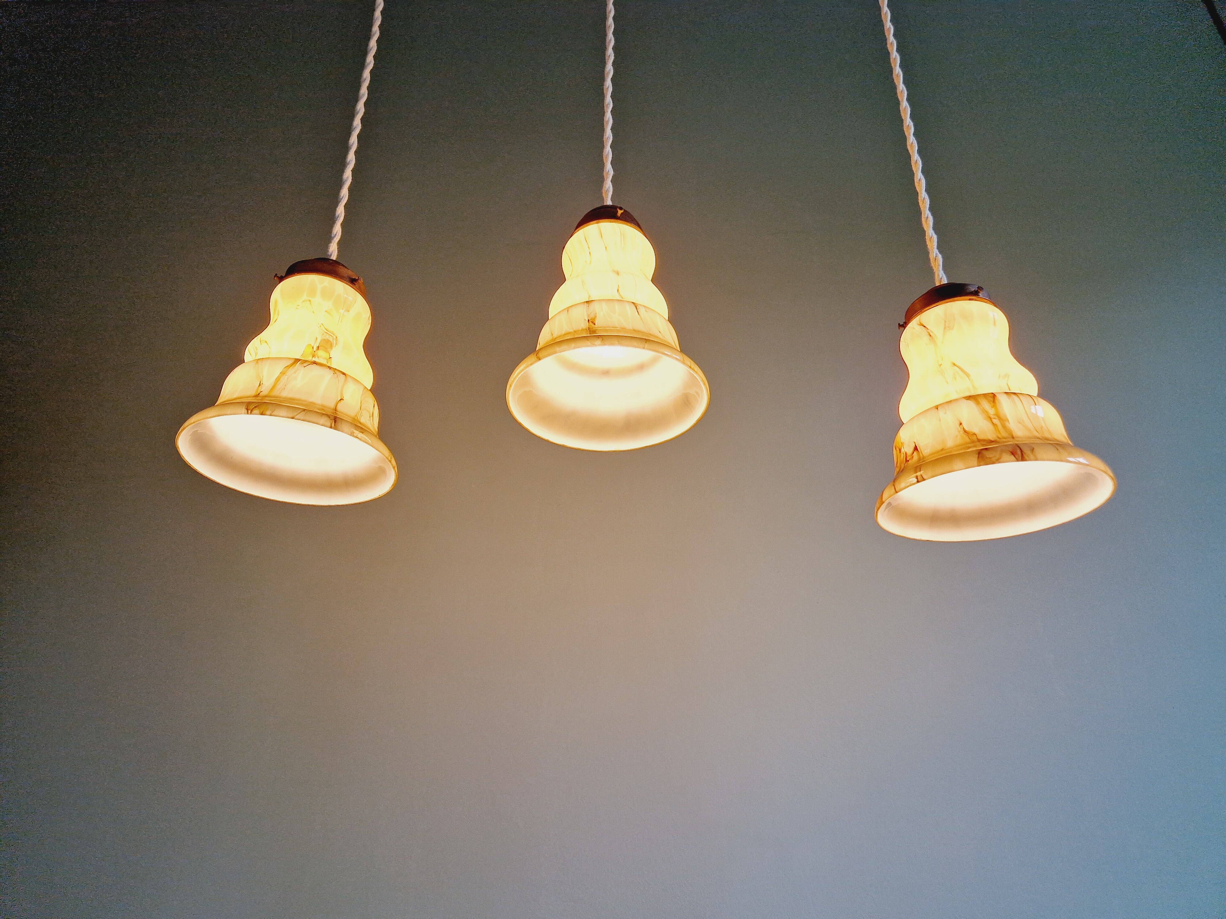 Set of 3 Art Deco marbled opaline pendant lights, 1920s-30s