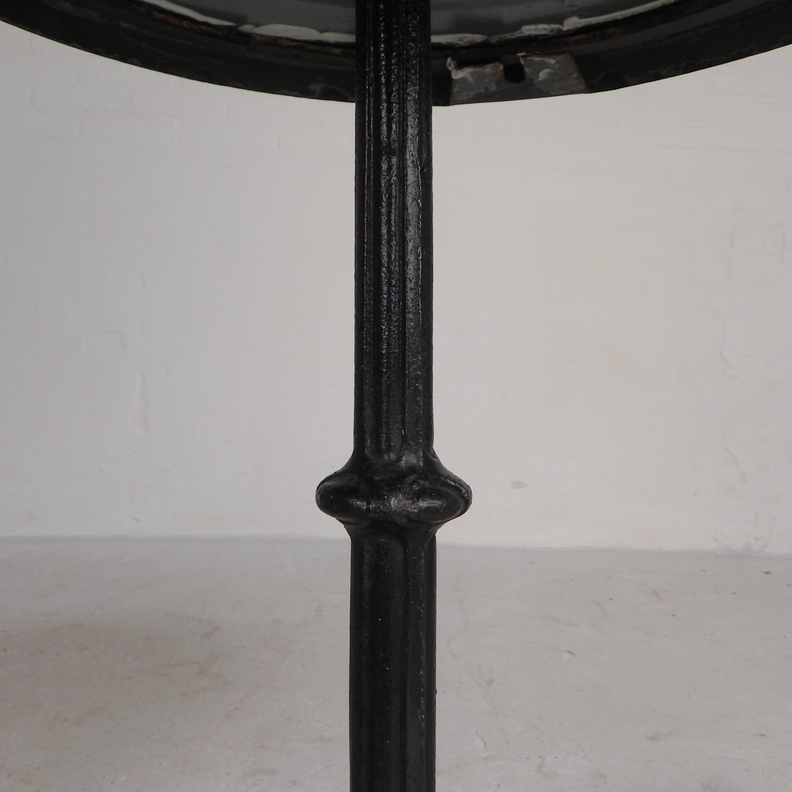 Bistro table with a cast iron base and a traffic sign as a tabletop, Paris 1920s.