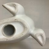 White earthenware sea lion in piggy bank