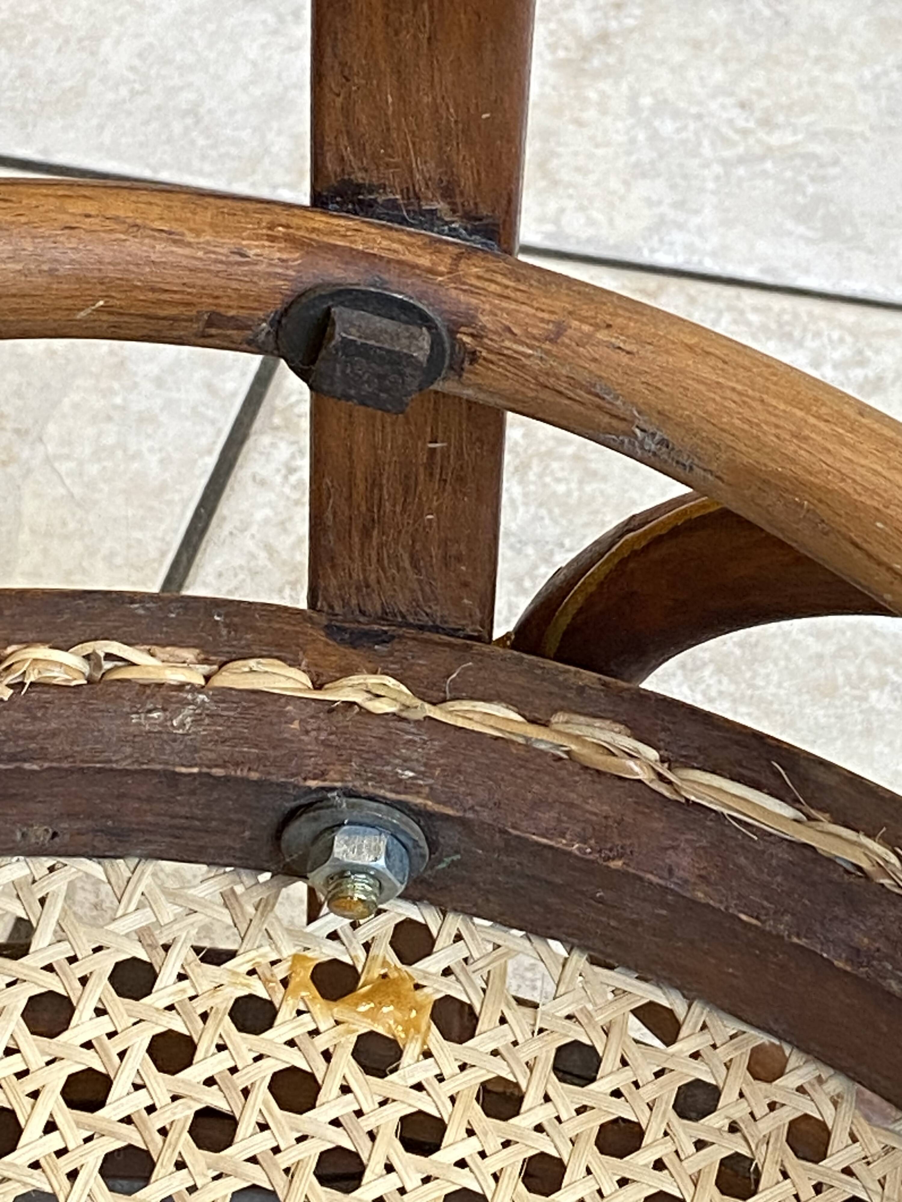Bistro chair with a curved wooden frame and caned seat from the 1930s.