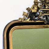Antique 1800s black and gold mirror with cupid, France 1800s.