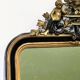 Antique 1800s black and gold mirror with cupid, France 1800s.