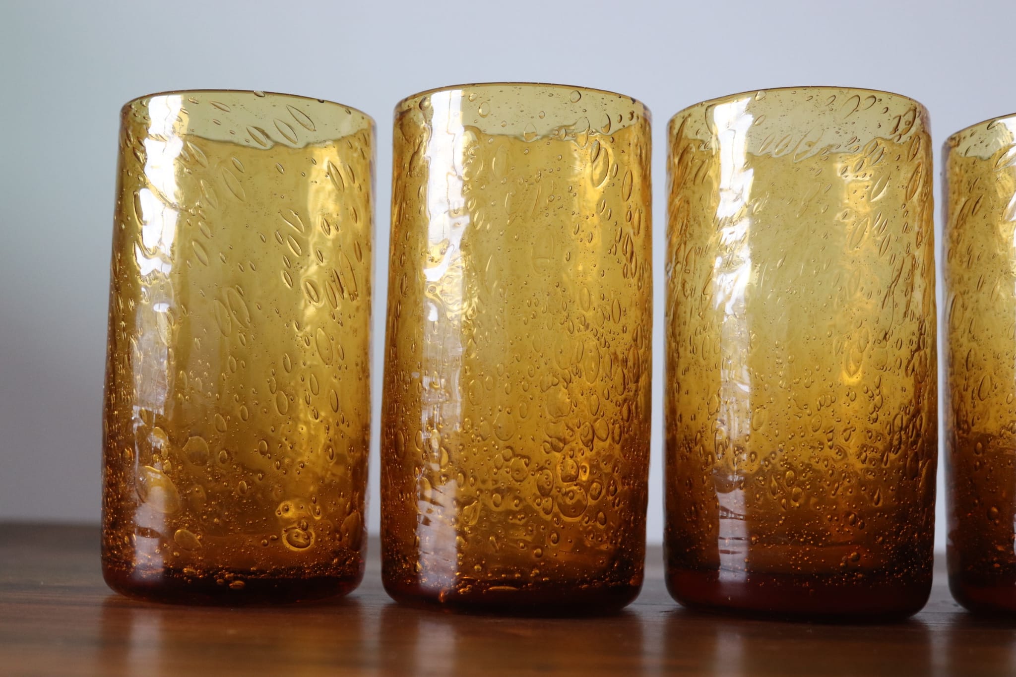 Set of 6 amber, blown and bubbled Biot glasses