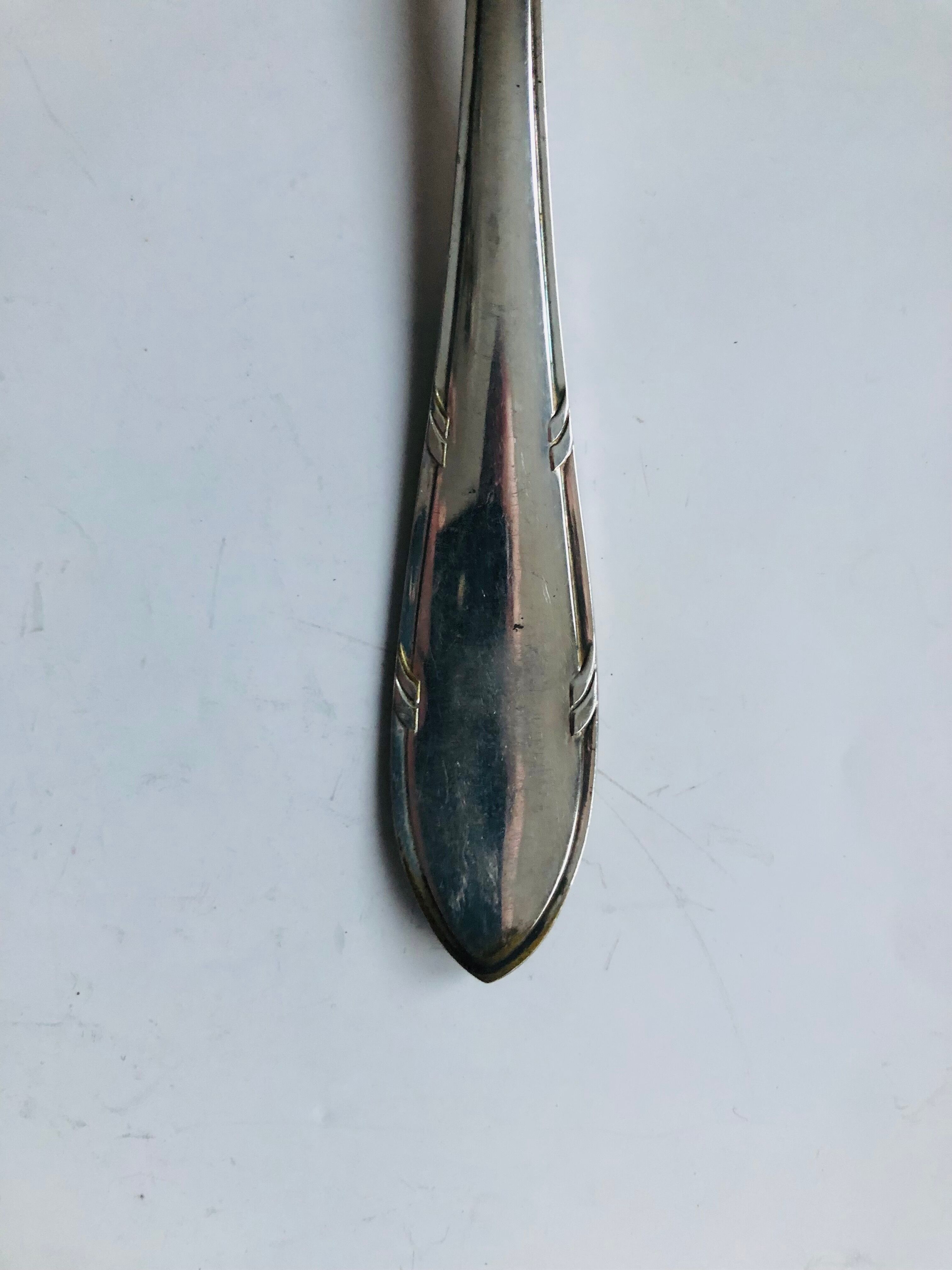 Set of twelve silver metal cutlery (24 pieces)