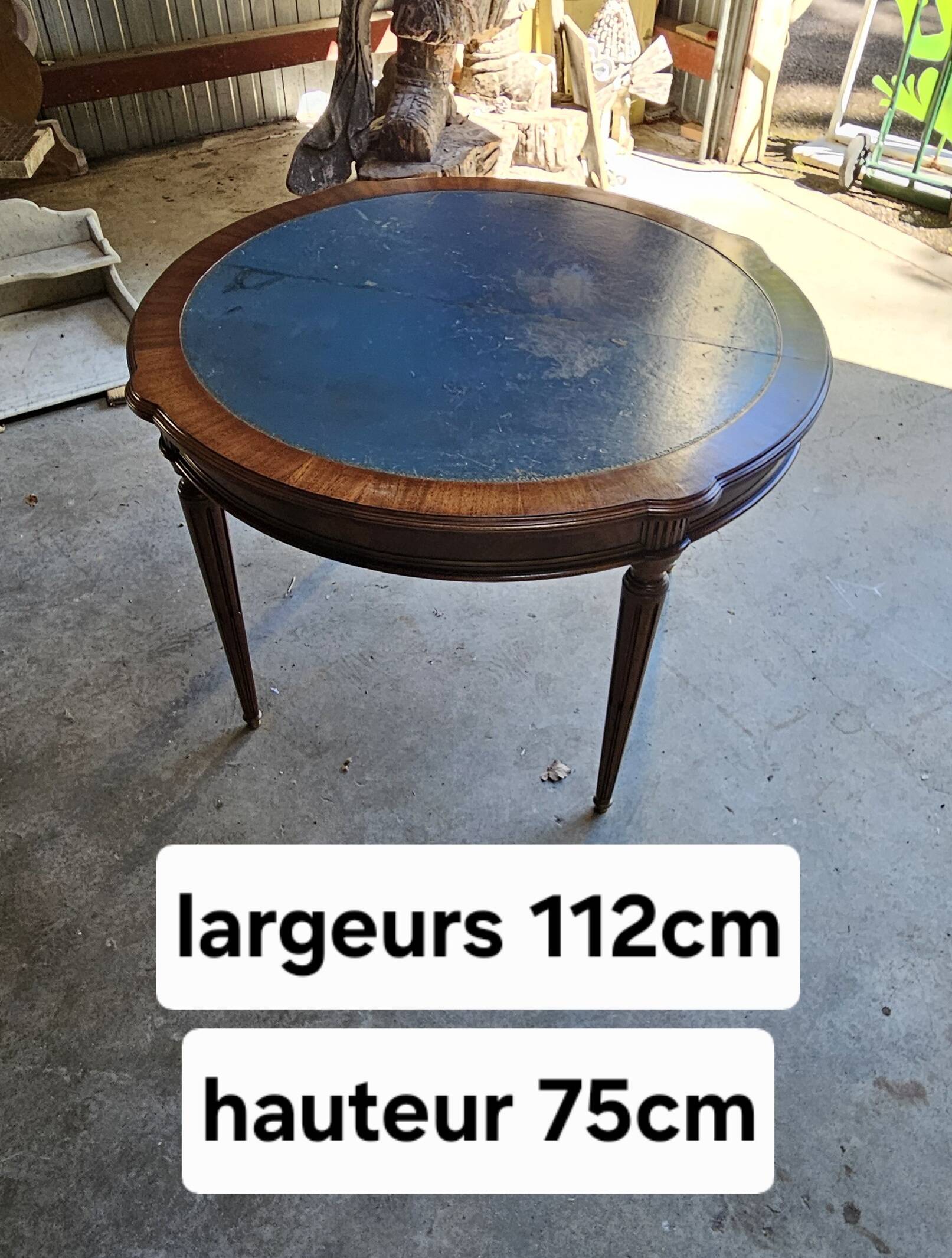 Elegant game table or circular extending side table in Louis XVI style.