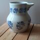 Large antique cruet in Saint Uze earthenware with blue flowers.