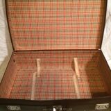 Suitcase vintage leather inside and brown carpeted home