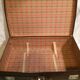 Suitcase vintage leather inside and brown carpeted home