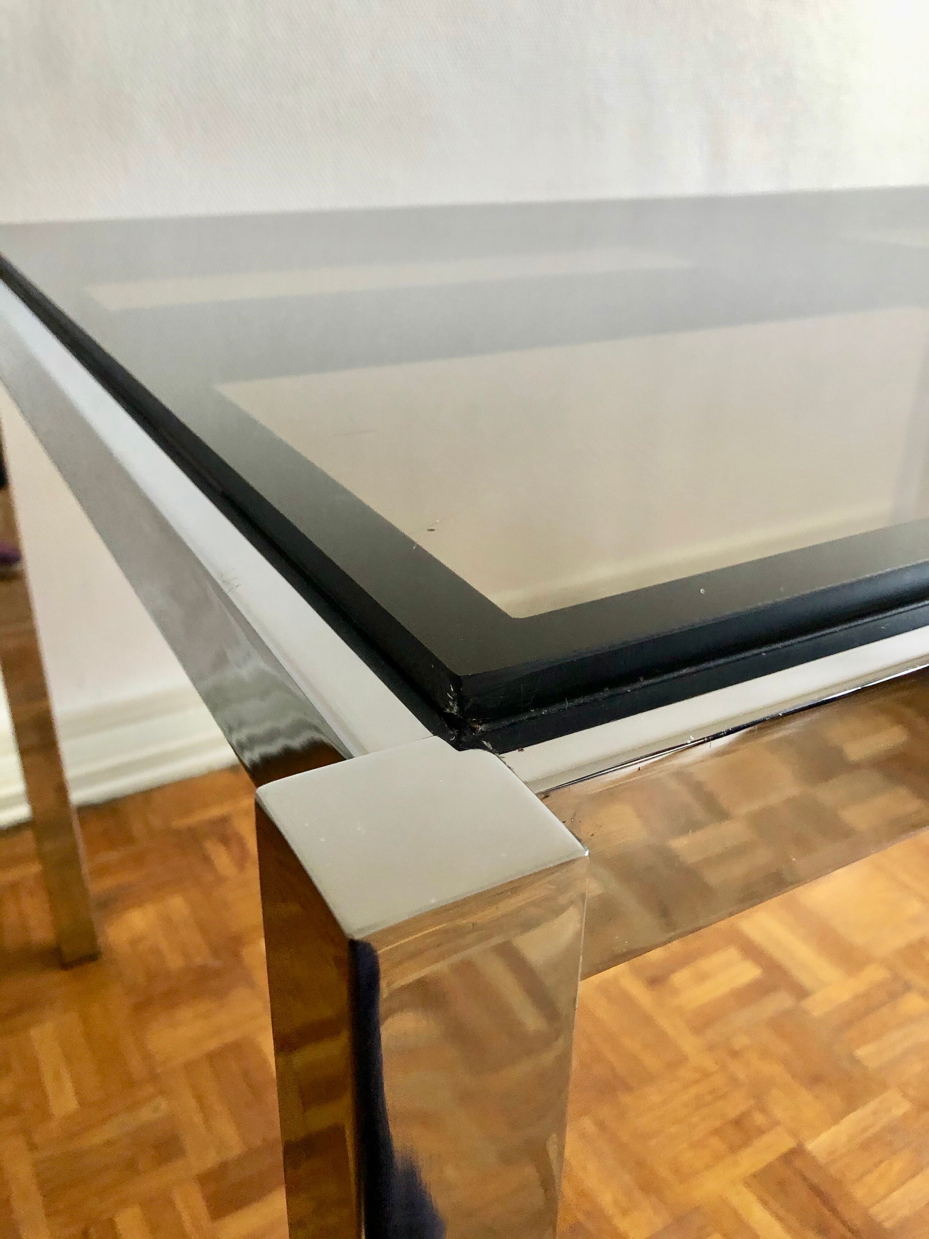 Glass and chrome metal dining table