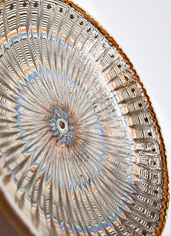 Traditional Romanian plate with psychedelic motifs from Horezu