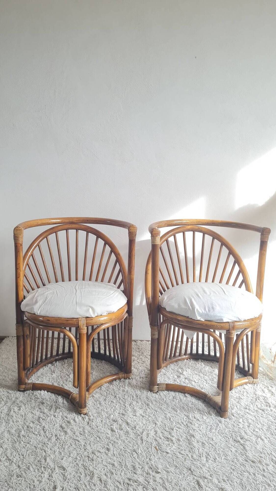 Pair of vintage rattan armchairs circa the 1960s.