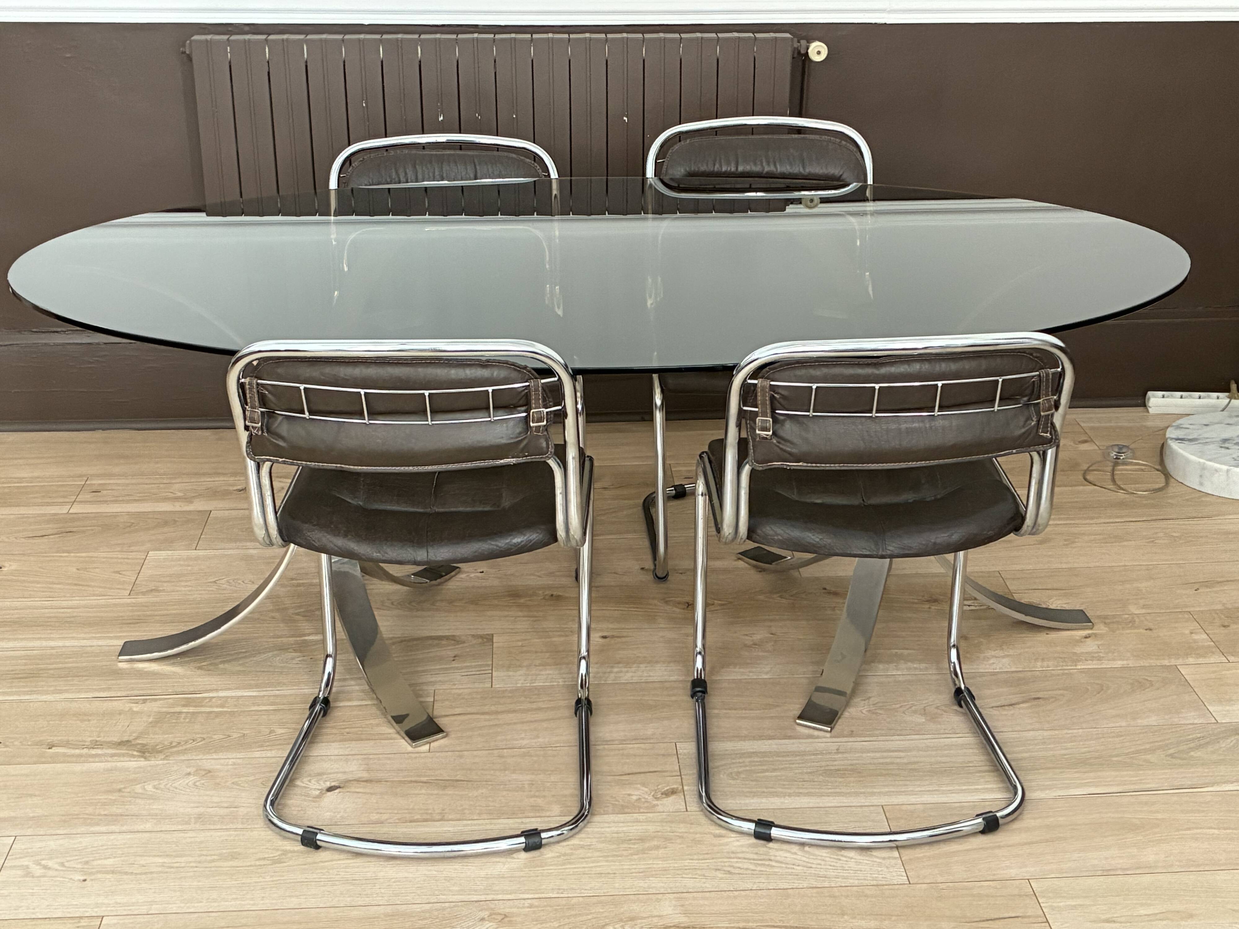 Smoked glass table with a metal base.