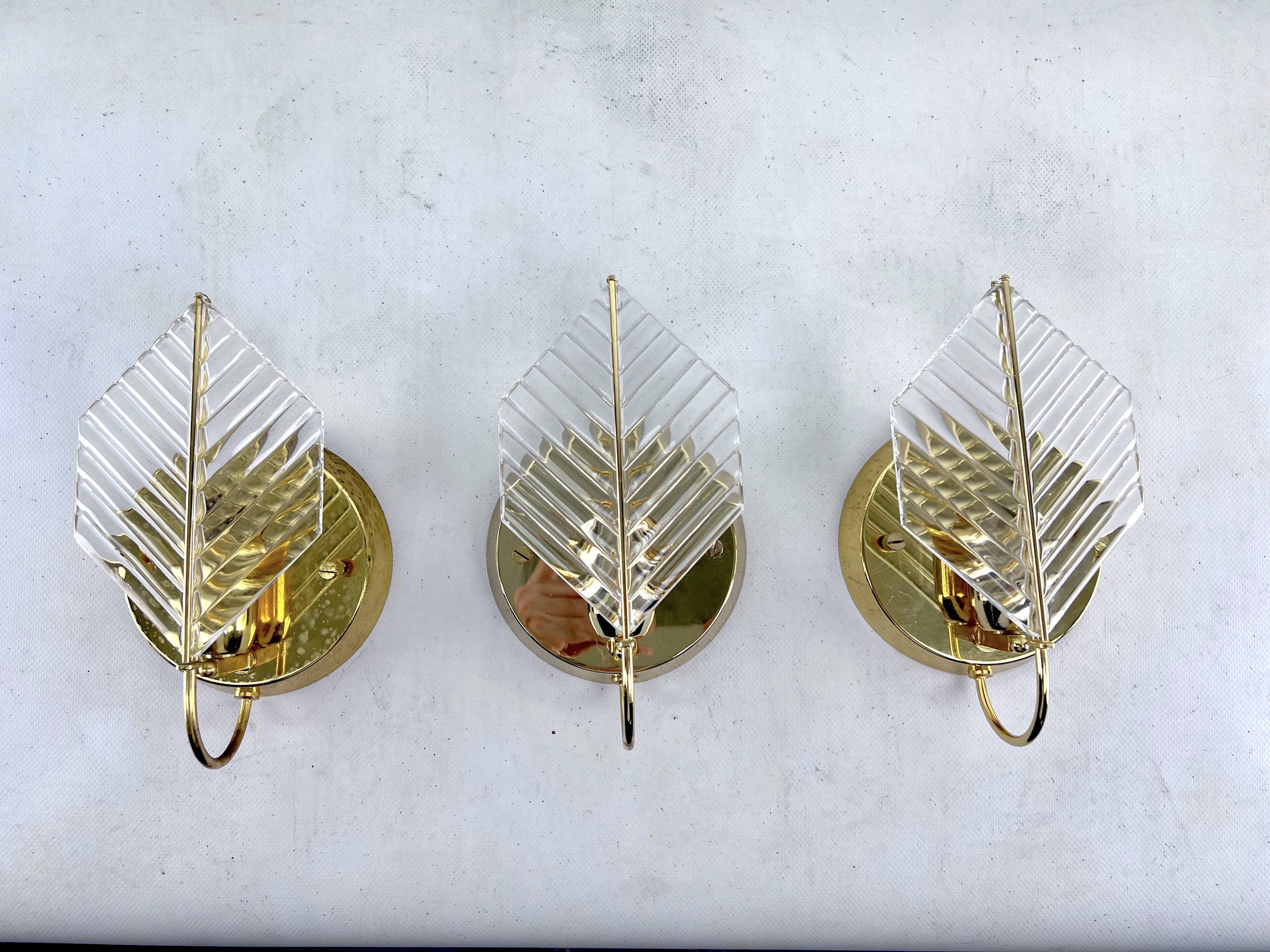 Vintage set of three sconces in brass and glass by Zero Quattro. Italy 1970s