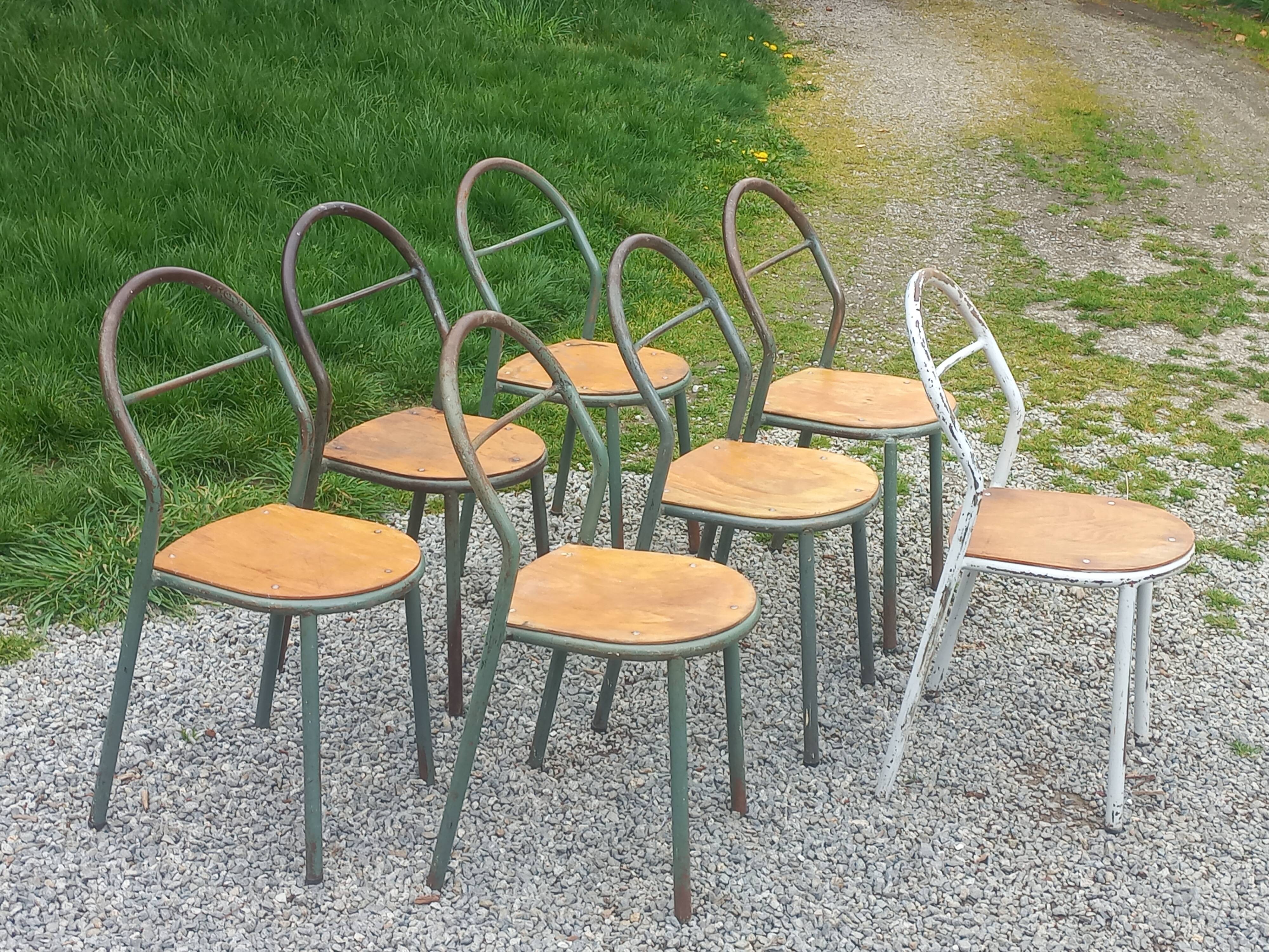 Set de 7 chaises de René Herbst métalliques assises bois