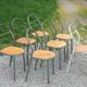 Set of 7 metal chairs by René Herbst with wooden seats.