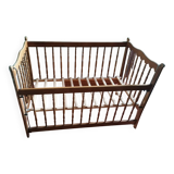 Wooden children's bed with sliding partition.