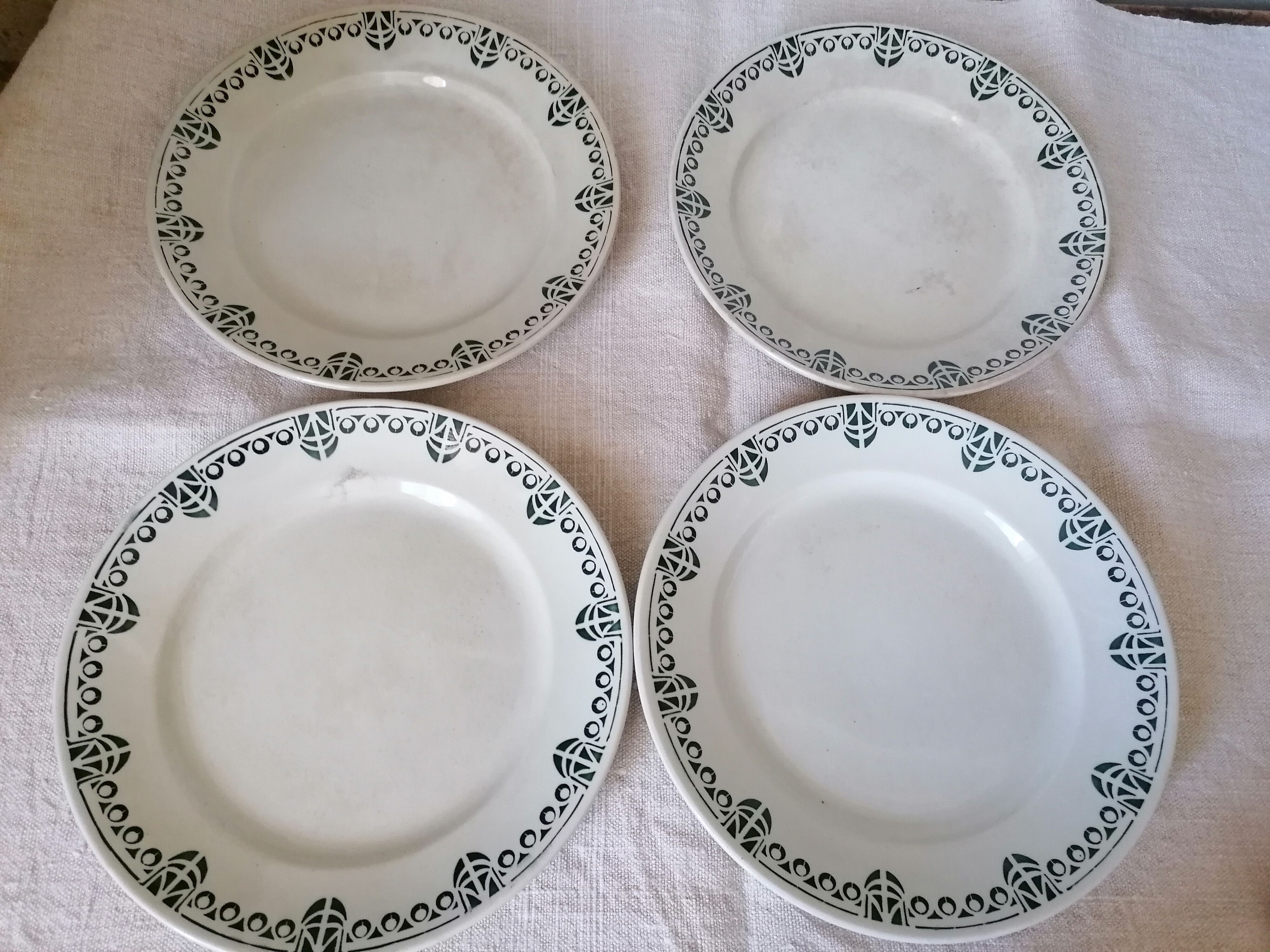 Set of 11 flat earthenware plates