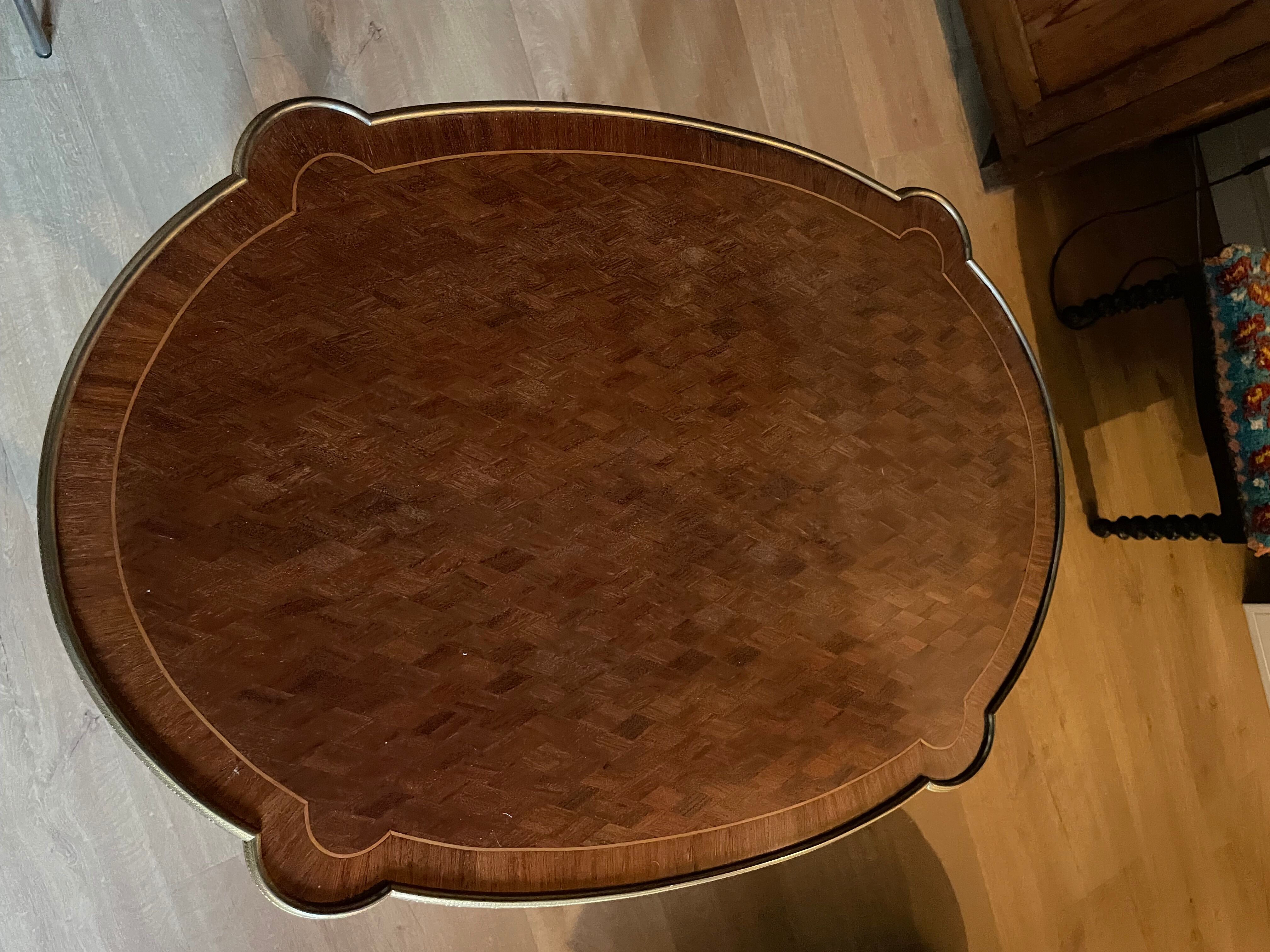 Living room table in Louis XV-Louis XVI transitional style with marquetry and bronze.