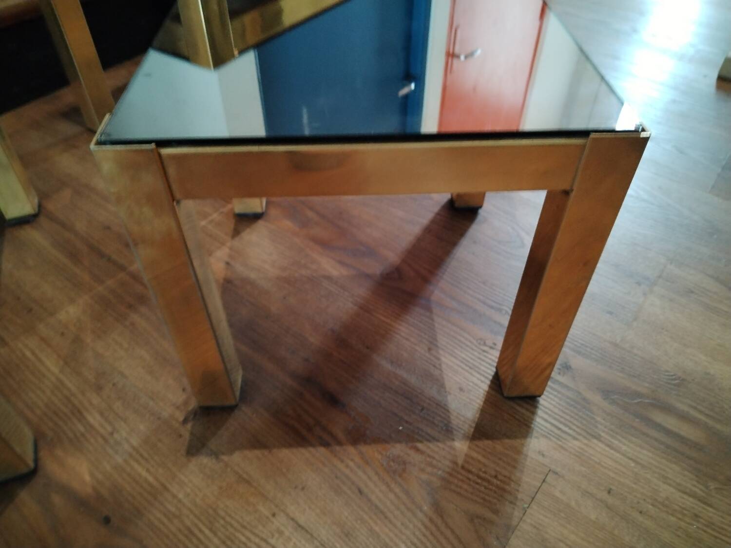 Vintage nesting table in gold metal and smoked mirror glass