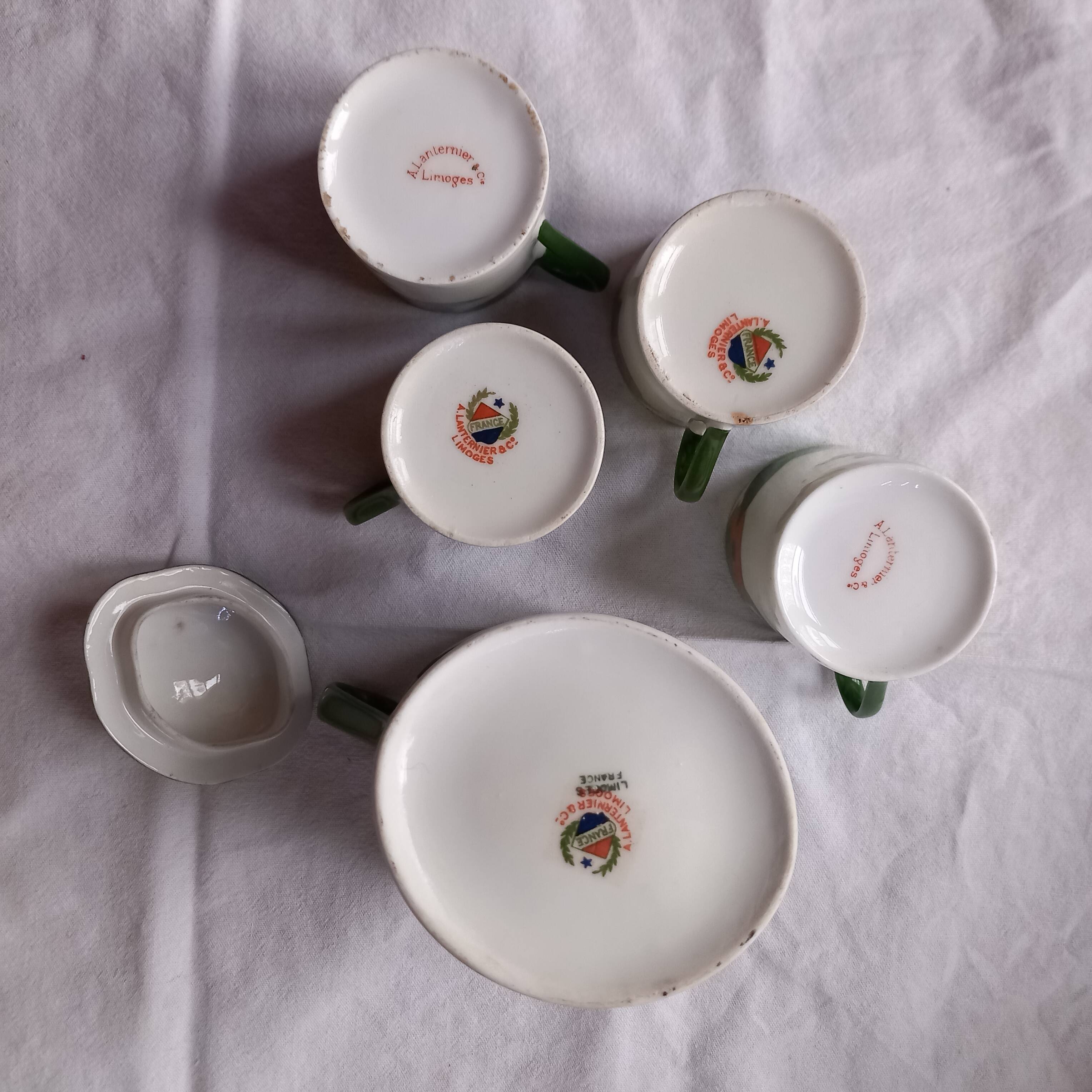 5 cups and a citrus sugar bowl, Lanternier Limoges porcelain