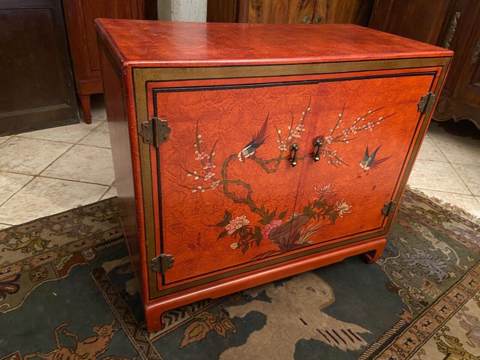 Low sideboard with lacquered decoration with birds on orange background Far East China Japan