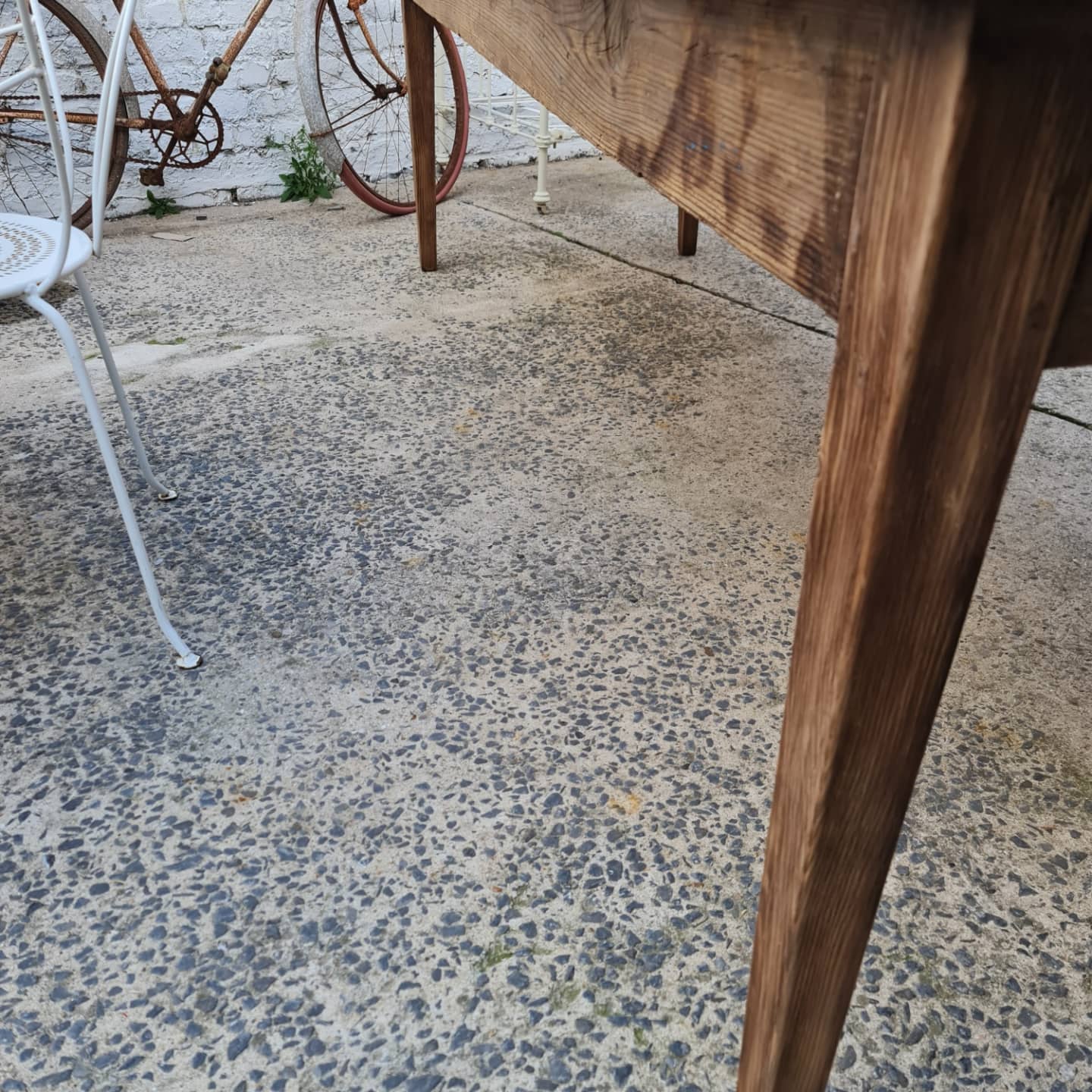 Large antique farmhouse table with a drawer