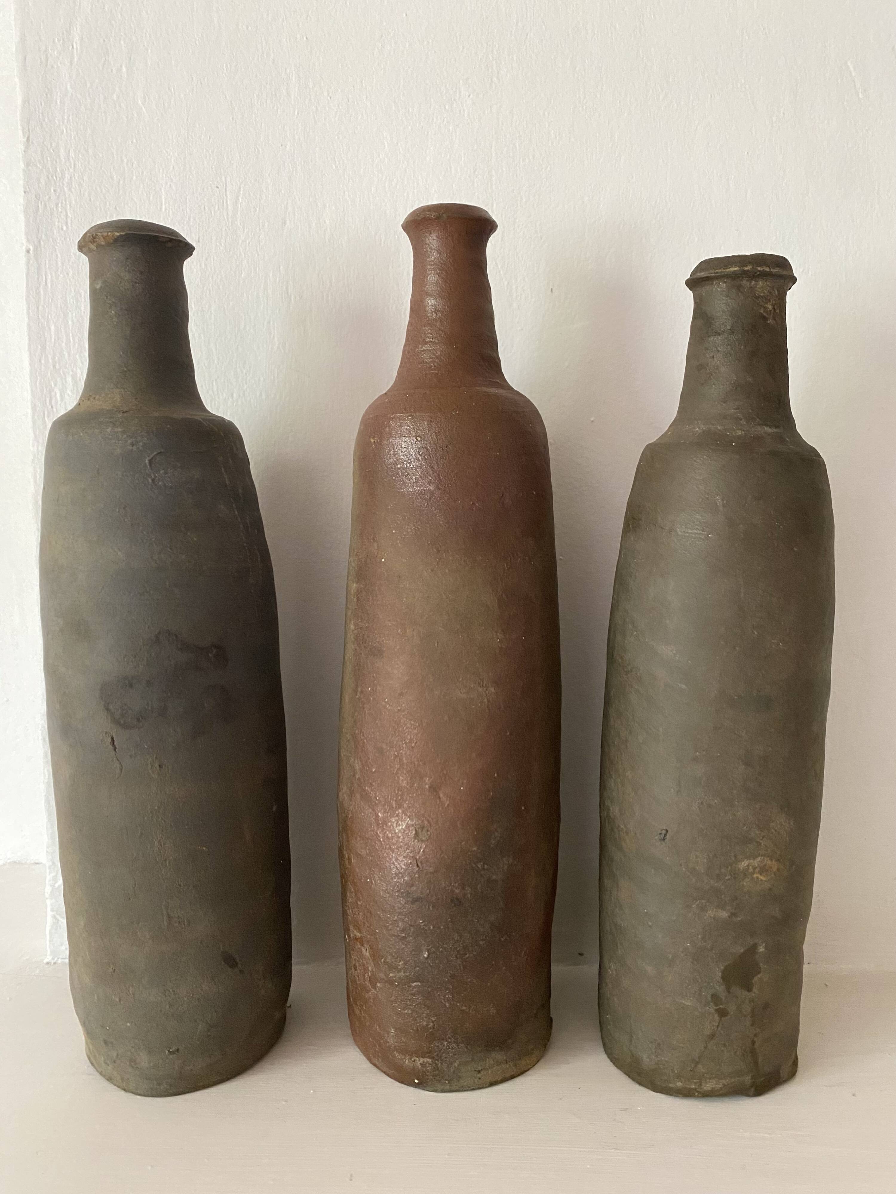 Antique terracotta cider bottles