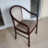 Square table in burgundy marble, its 4 matching chairs in white fabric and its buffet