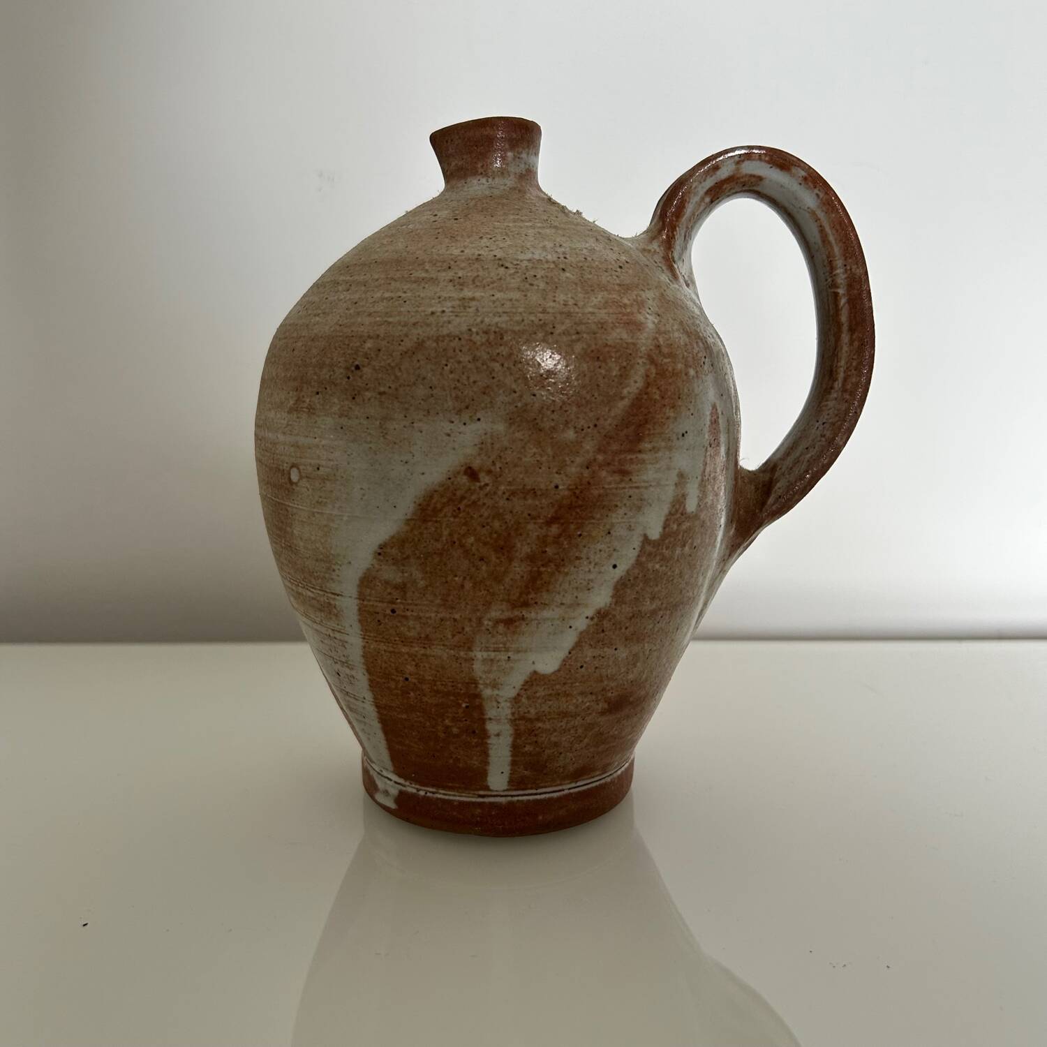 Patinated stoneware jug